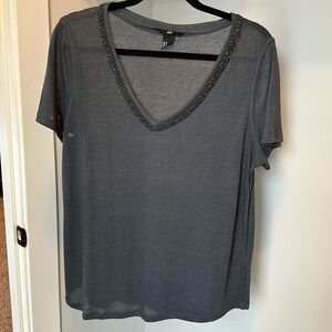 V-neck short sleeve shirt with embellished neckline